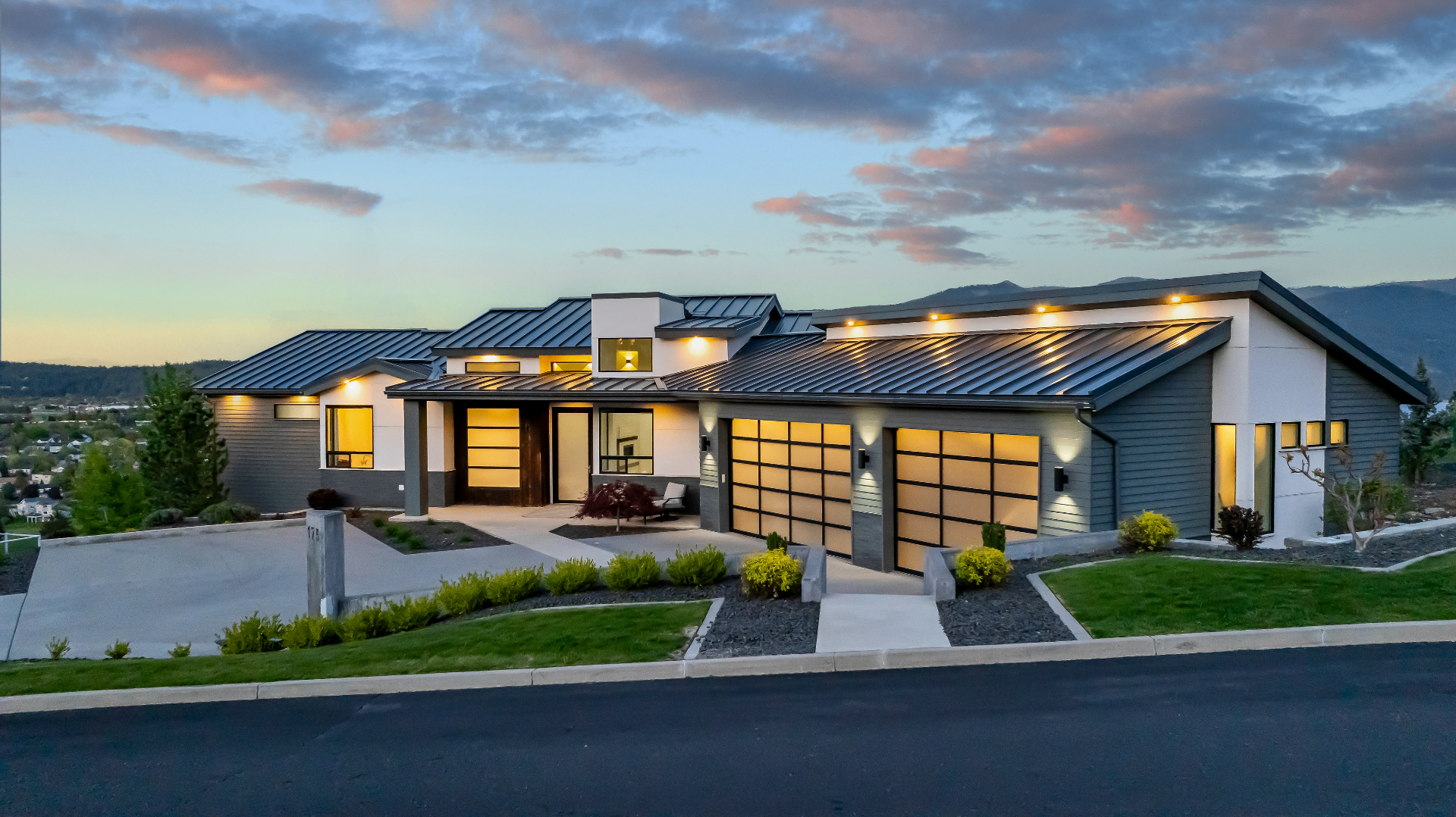 Modern luxury home exterior at dusk